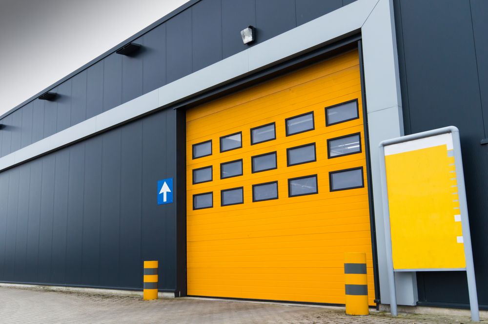 Yellow Loading Door — Garage Doors in Pottsville, NSW